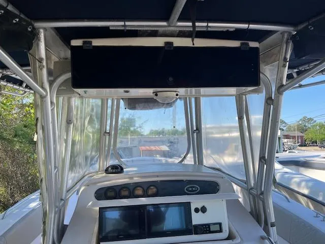 Slide: The Image of 2003 Grady-White 306 CC boat cockpit with navigation equipment and canopy. - 15