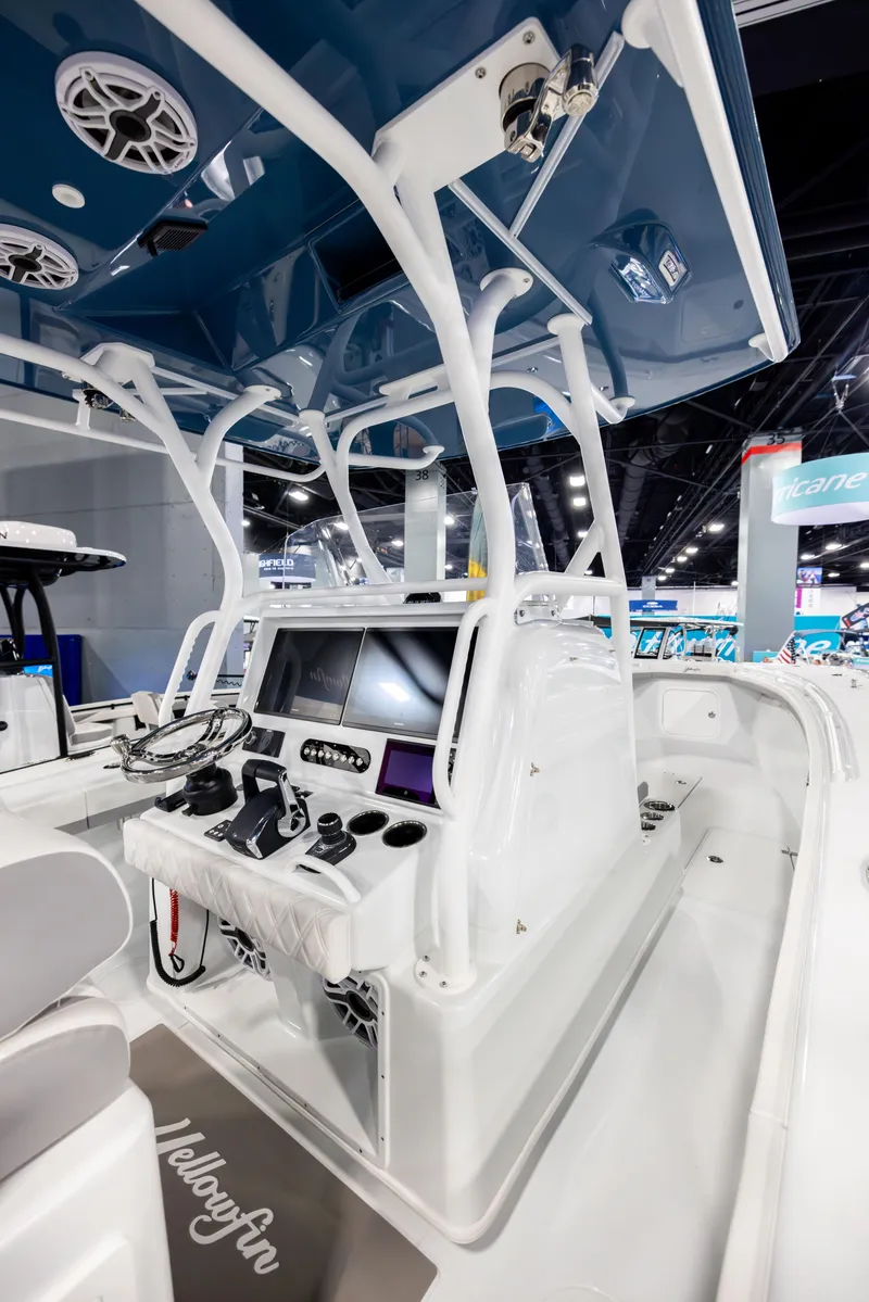 Slide: The Image of 2025 Yellowfin 32 Offshore boat interior with advanced navigation system and sleek design. - 16