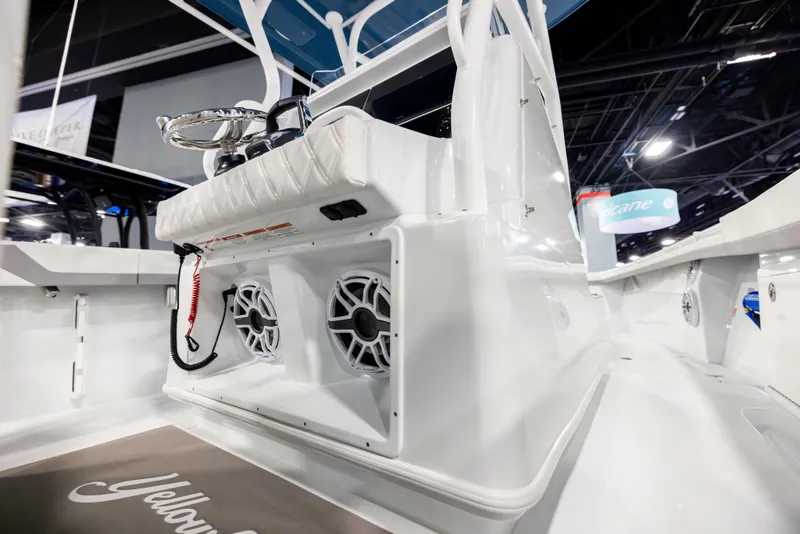 Slide: The Image of 2025 Yellowfin 32 Offshore boat interior with speakers and seating. - 17