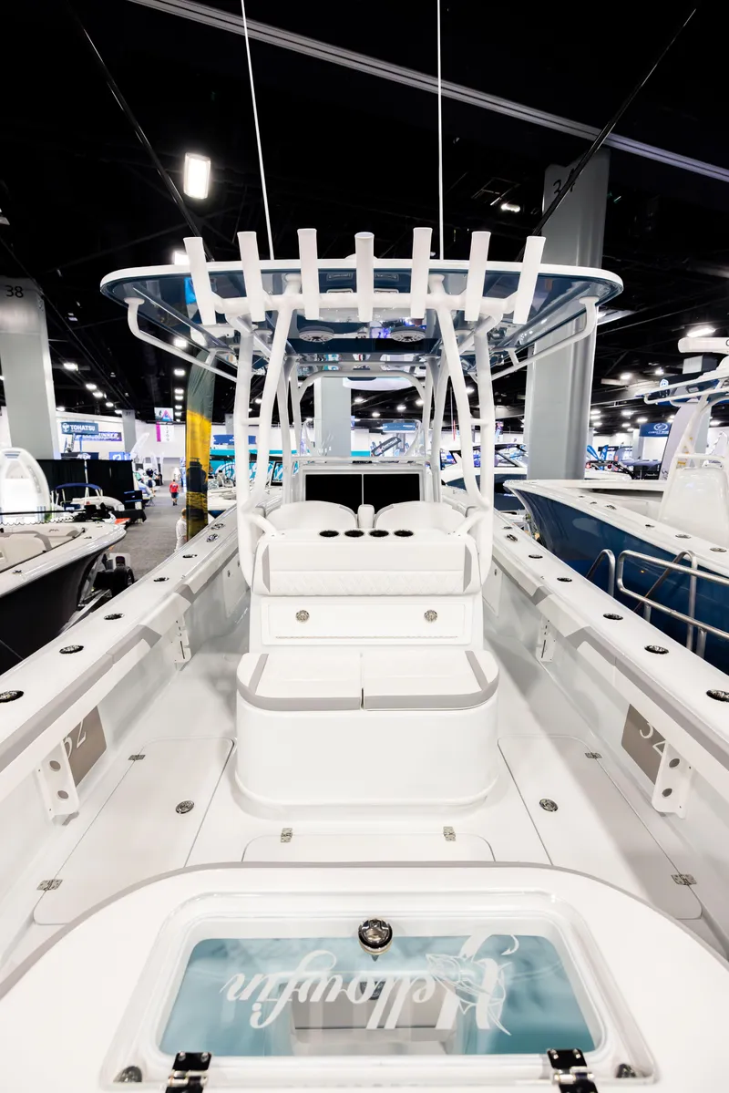 Slide: The Image of 2025 Yellowfin 32 Offshore boat interior at a boat show, showcasing sleek design and spacious layout. - 5