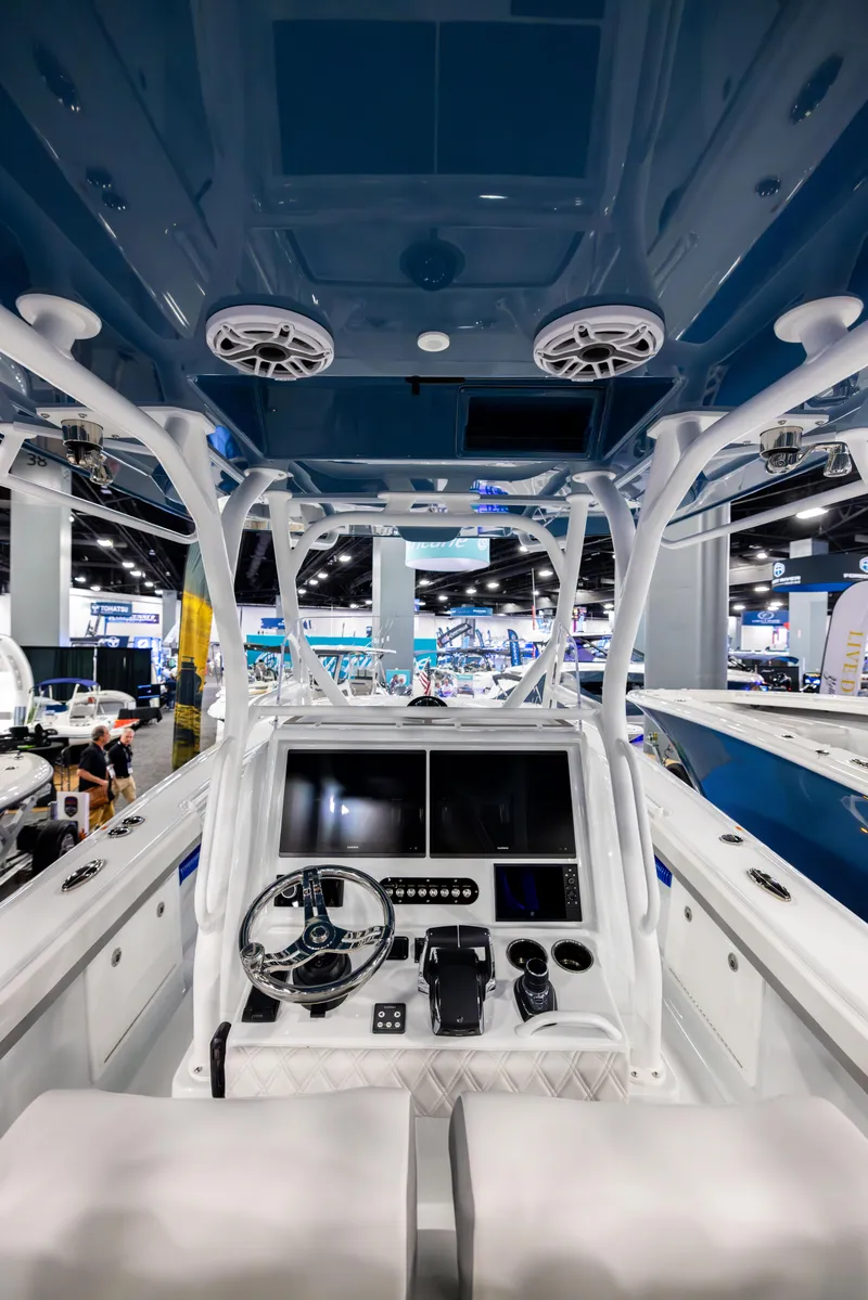 Slide: The Image of 2025 Yellowfin 32 Offshore boat interior with advanced navigation system and sleek design. - 6