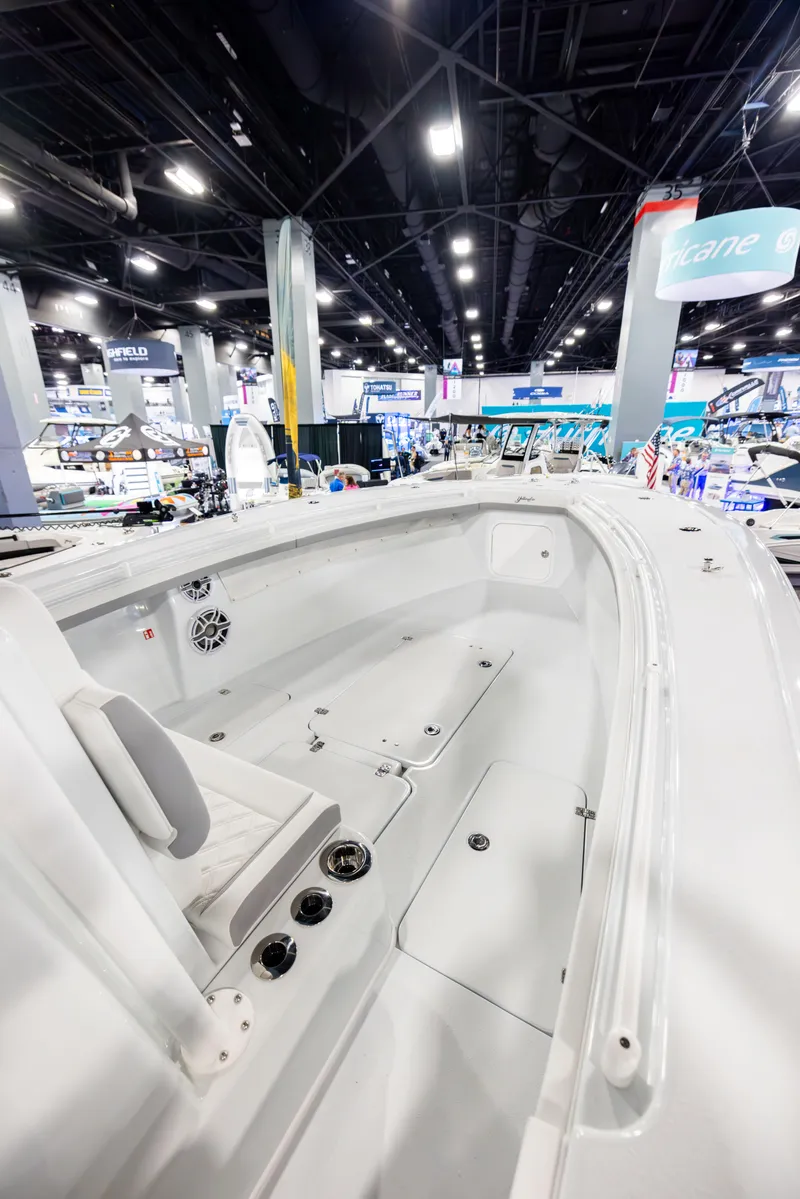 Slide: The Image of 2025 Yellowfin 32 Offshore boat interior at a boat show, showcasing spacious design and modern features. - 8