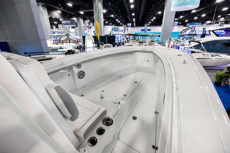 Slide: The Image of 2025 Yellowfin 32 Offshore boat interior at a boat show, showcasing sleek design and spacious layout. - 9