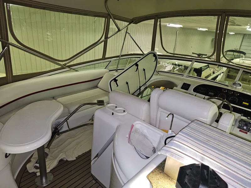 Slide: The Image of 2001 Cruisers Yachts 5000 Sedan Sport interior with helm, seating, and navigation equipment. - 10