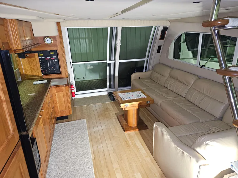 Slide: The Image of Interior of 2001 Cruisers Yachts 5000 Sedan Sport with kitchen and seating area. - 20