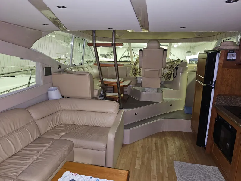 Slide: The Image of Luxurious interior of 2001 Cruisers Yachts 5000 Sedan Sport with leather seating and modern amenities. - 29