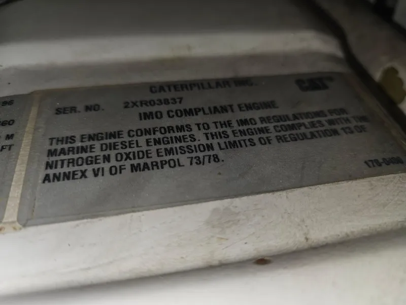 Slide: The Image of 2001 Cruisers Yachts 5000 Sedan Sport engine compliance label, Caterpillar IMO compliant. - 47