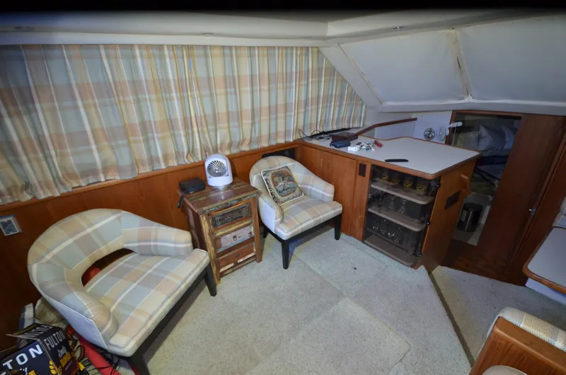 Slide: The Image of Interior of 1993 Carver 350 Aft yacht with seating and storage. - 2