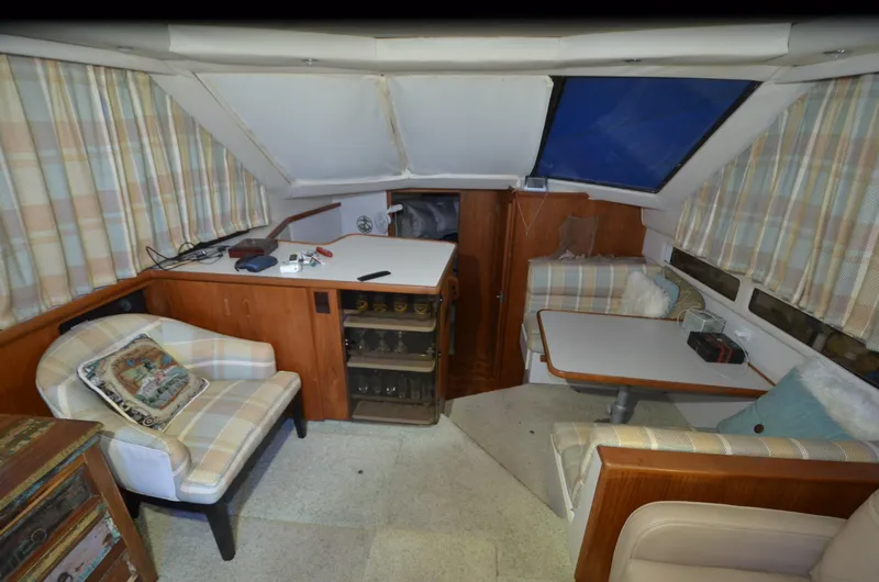 Slide: The Image of Interior of 1993 Carver 350 Aft cabin with seating and table. - 4