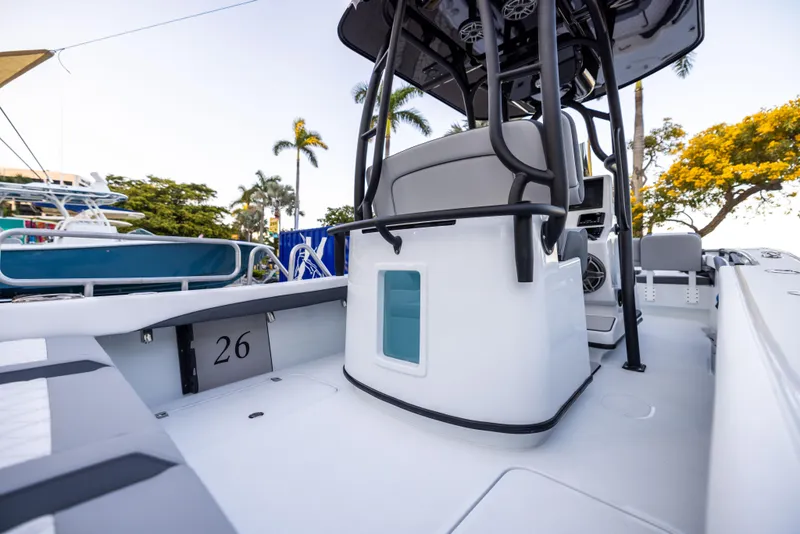 Slide: The Image of 2025 Yellowfin 26 Hybrid boat, sleek design, spacious deck, modern features, palm trees in background. - 4