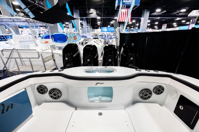 Slide: The Image of 2025 Yellowfin 39 Offshore boat interior with multiple engines and modern design at a boat show. - 4