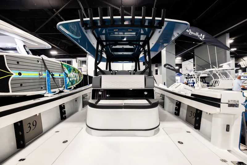Slide: The Image of 2025 Yellowfin 39 Offshore boat interior at a showroom, showcasing sleek design and spacious layout. - 5