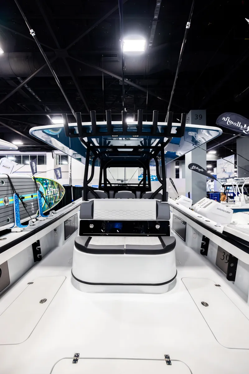 Slide: The Image of 2025 Yellowfin 39 Offshore boat displayed at an indoor exhibition. - 6