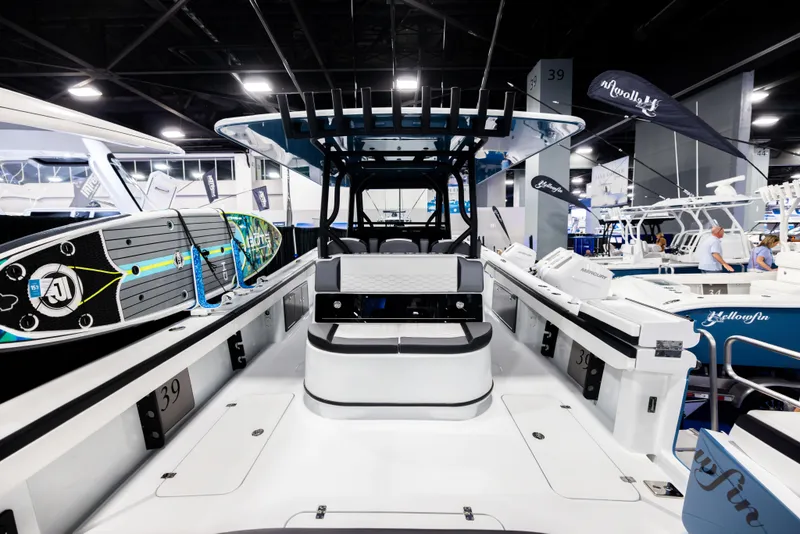 Slide: The Image of 2025 Yellowfin 39 Offshore boat interior at a boat show, featuring sleek design and equipment. - 7