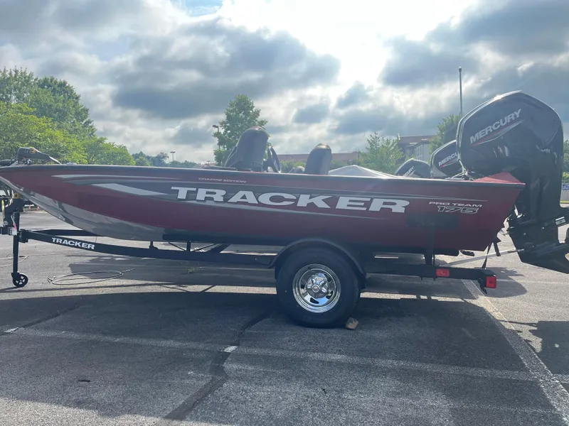 Slide: The Image of 2025 Tracker Pro Team 175 Crappie Edition boat interior with fishing gear and seating. - 2