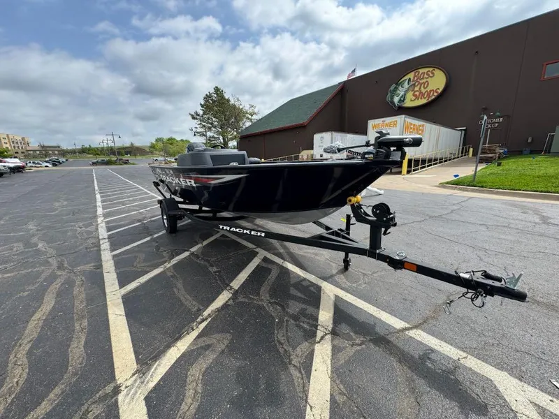 Slide: The Image of 2025 Tracker Pro Team 190 boat on trailer outside Bass Pro Shops. - 5