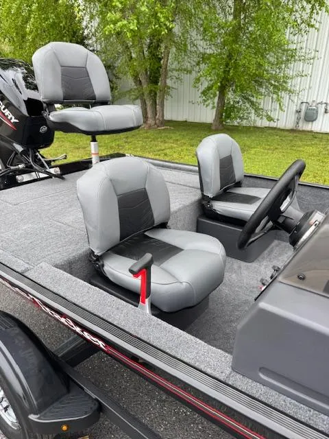 Slide: The Image of 2025 Tracker Bass Tracker Classic XL boat with gray seating and steering console. - 10