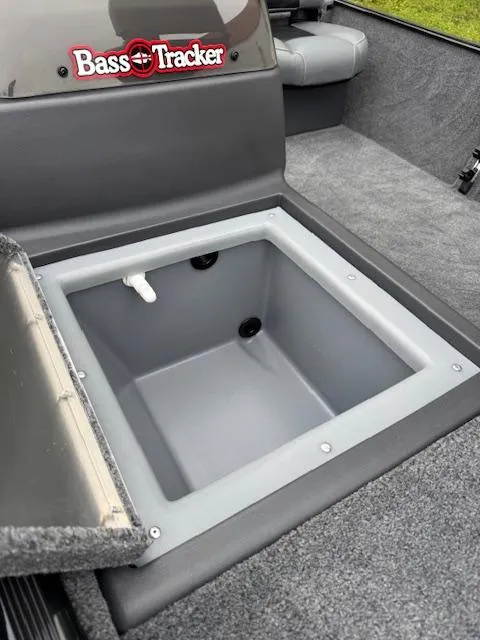 Slide: The Image of 2025 Tracker Bass Tracker Classic XL boat with open storage compartment. - 12
