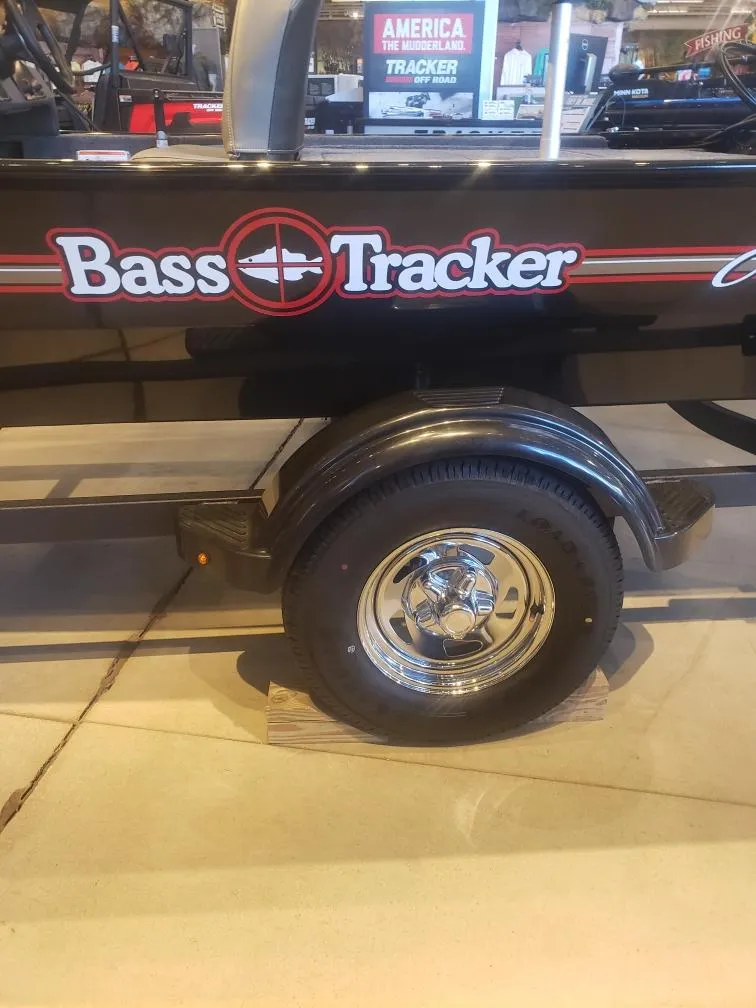 Slide: The Image of 2025 Tracker Bass Tracker Classic XL trailer with logo and shiny wheel. - 16