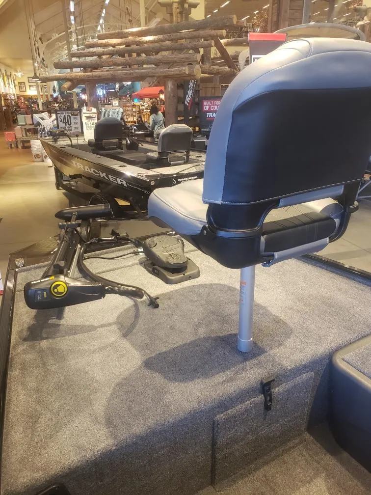 Slide: The Image of 2025 Tracker Bass Tracker Classic XL boat interior with seating and equipment display. - 18