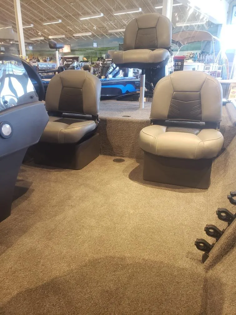 Slide: The Image of 2025 Tracker Bass Tracker Classic XL boat interior with three cushioned seats. - 19