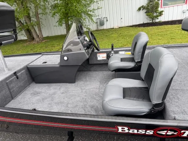 Slide: The Image of 2025 Tracker Bass Tracker Classic XL boat interior with gray seating and steering console. - 8