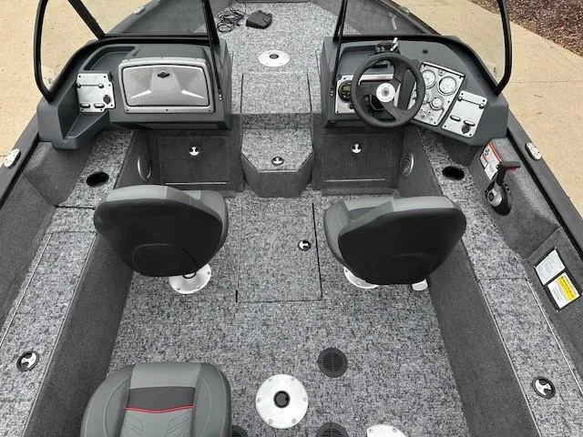 Slide: The Image of 2025 Tracker Pro Guide V-175 WT boat interior with dual seats and modern dashboard. - 7