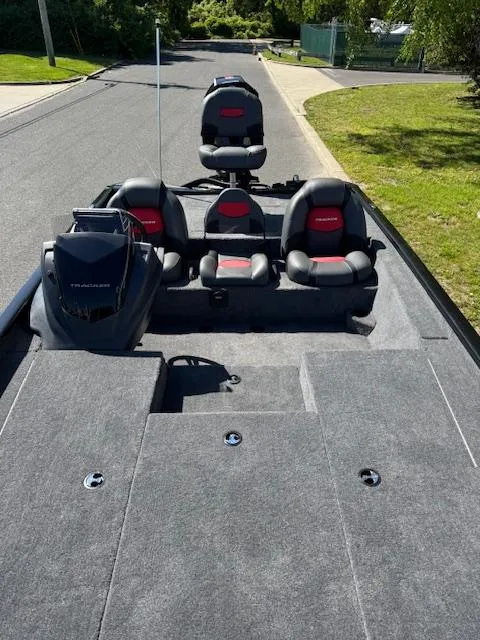 Slide: The Image of 2025 Tracker Savage 215 boat interior with seating and storage compartments. - 13