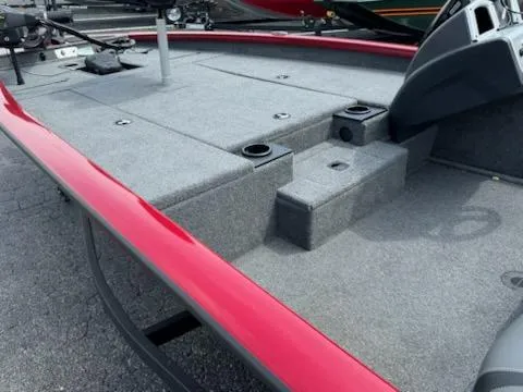 Slide: The Image of 2025 Tracker Pro Team 190 boat deck with red trim and fishing rod holders. - 5