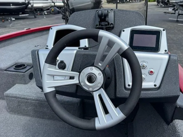 Slide: The Image of Steering wheel and dashboard of 2025 Tracker Pro Team 190 boat. - 8