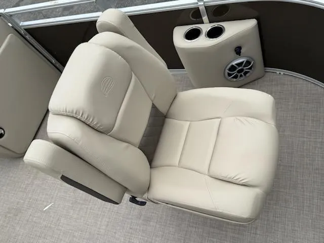 Slide: The Image of Luxurious seating on 2025 Sun Tracker SportFish 20 DLX pontoon boat with cup holders and speaker. - 6