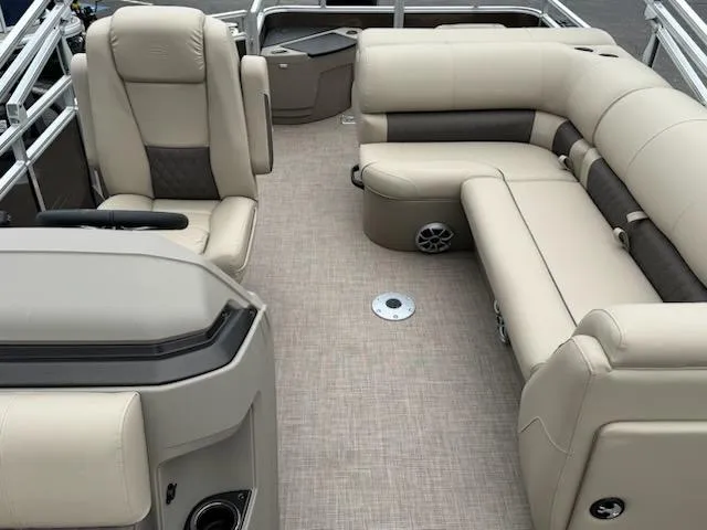 Slide: The Image of 2025 Sun Tracker SportFish 20 DLX interior with beige seating and modern design. - 7
