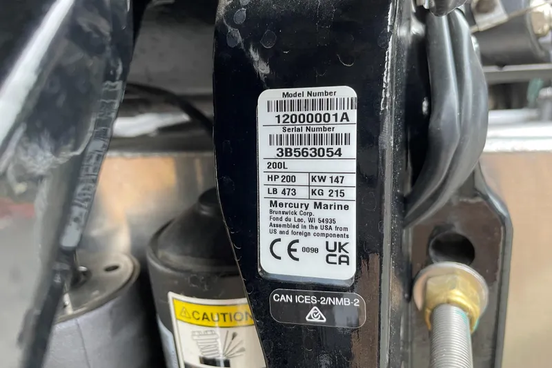 Slide: The Image of Label on Mercury Marine engine, showing model and serial numbers, attached to Sun Tracker SportFish 22 XP3. - 86