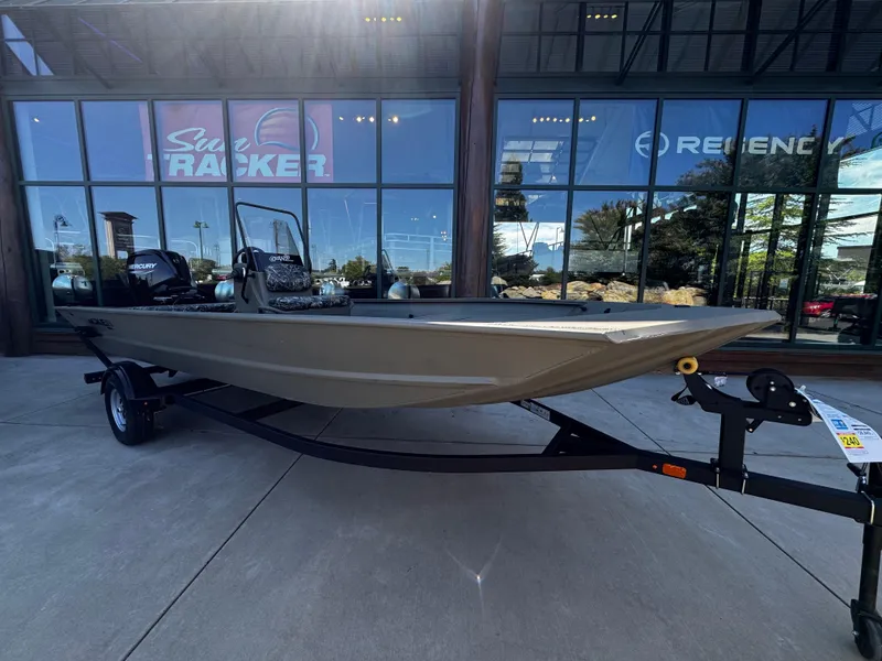 The Image of 2025 Tracker Grizzly 1860 CC boat on trailer, displayed outside showroom. - 0