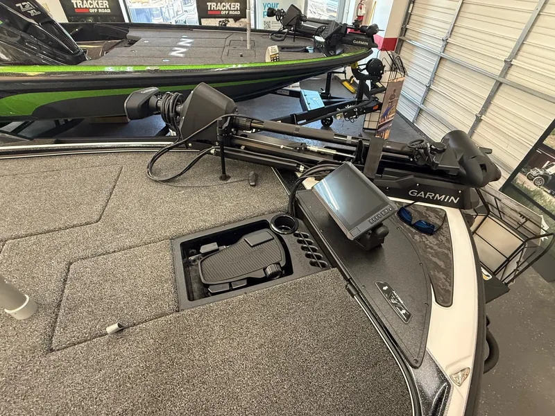 Slide: The Image of 2025 Nitro Z20 XL Pro boat with Garmin electronics and trolling motor in showroom. - 6