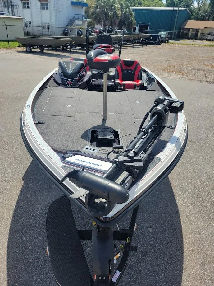 Slide: The Image of 2021 Ranger Z520L bass boat with trolling motor, parked outdoors. - 4