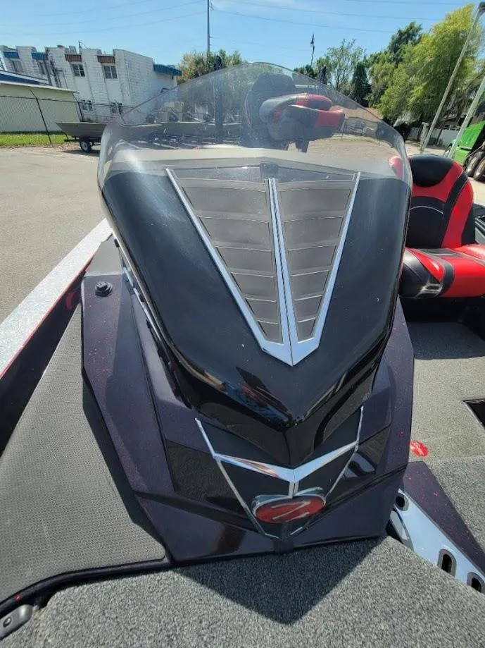Slide: The Image of 2021 Ranger Z520L boat with sleek black design and modern windshield. - 6