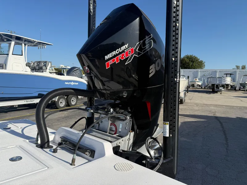 Slide: The Image of 1998 Lake & Bay Boca Grande 20 boat on trailer in marina setting. - 1