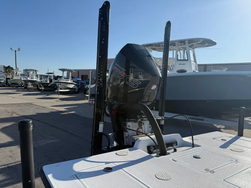Slide: The Image of 1998 Lake & Bay Boca Grande 20 boat with outboard motor in a marina setting. - 13