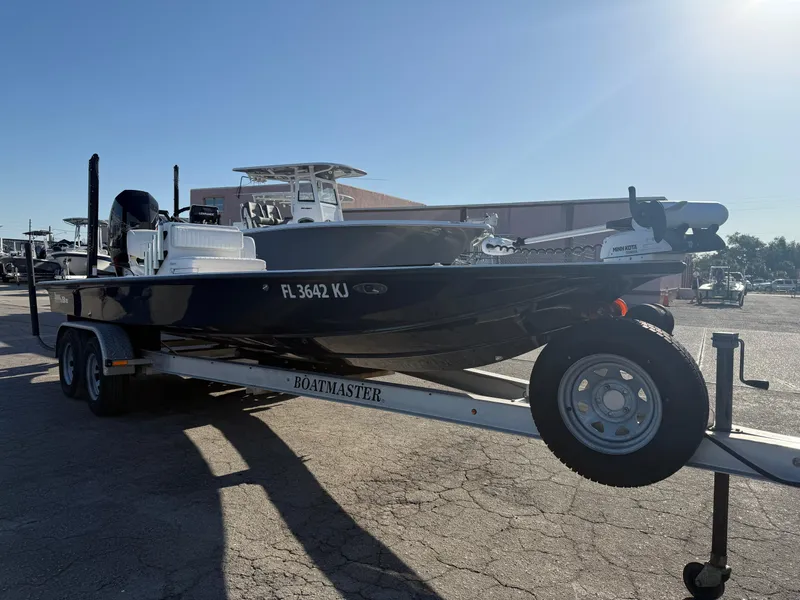 Slide: The Image of 1998 Lake & Bay Boca Grande 20 boat on trailer in sunny outdoor setting. - 17