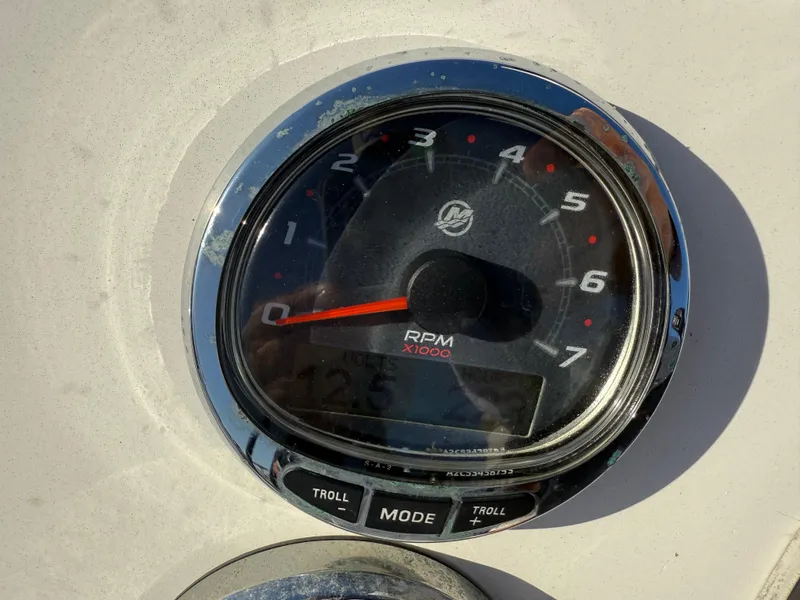 Slide: The Image of Tachometer of 1998 Lake & Bay Boca Grande 20 boat, showing RPM and controls. - 6