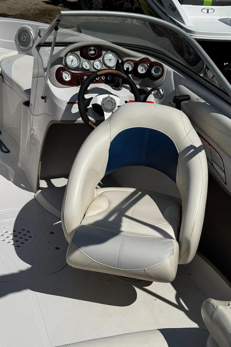 Slide: The Image of 2011 Tahoe Q7i boat interior with steering wheel and dashboard controls. - 24
