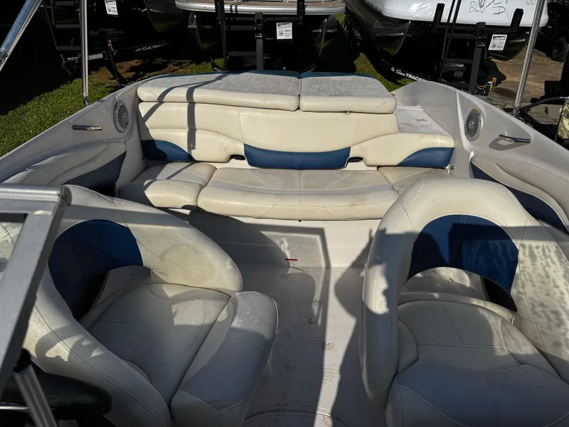Slide: The Image of 2011 Tahoe Q7i boat interior with white and blue seating, featuring spacious layout and comfortable design. - 27