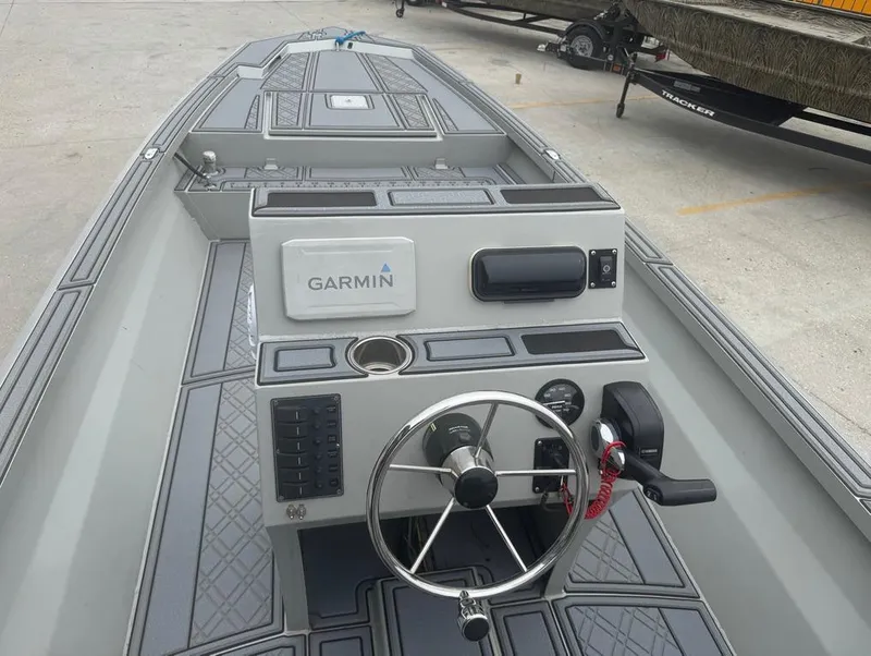 Slide: The Image of Custom Rene Gros 20 CC boat dashboard with Garmin navigation, 2023 model. - 12