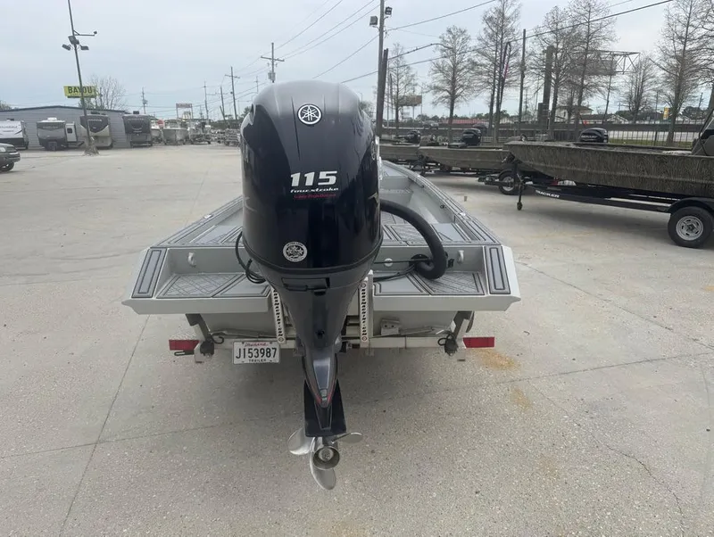 Slide: The Image of Custom Rene Gros 20 CC boat, 2023 model, with Yamaha 115 outboard motor in a parking lot. - 7