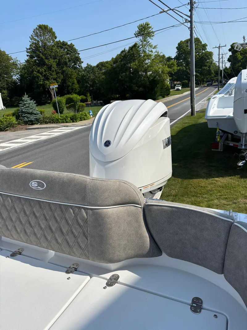 Slide: The Image of 2026 Sea Hunt Ultra 235 SE boat with Yamaha outboard motor on display. - 3