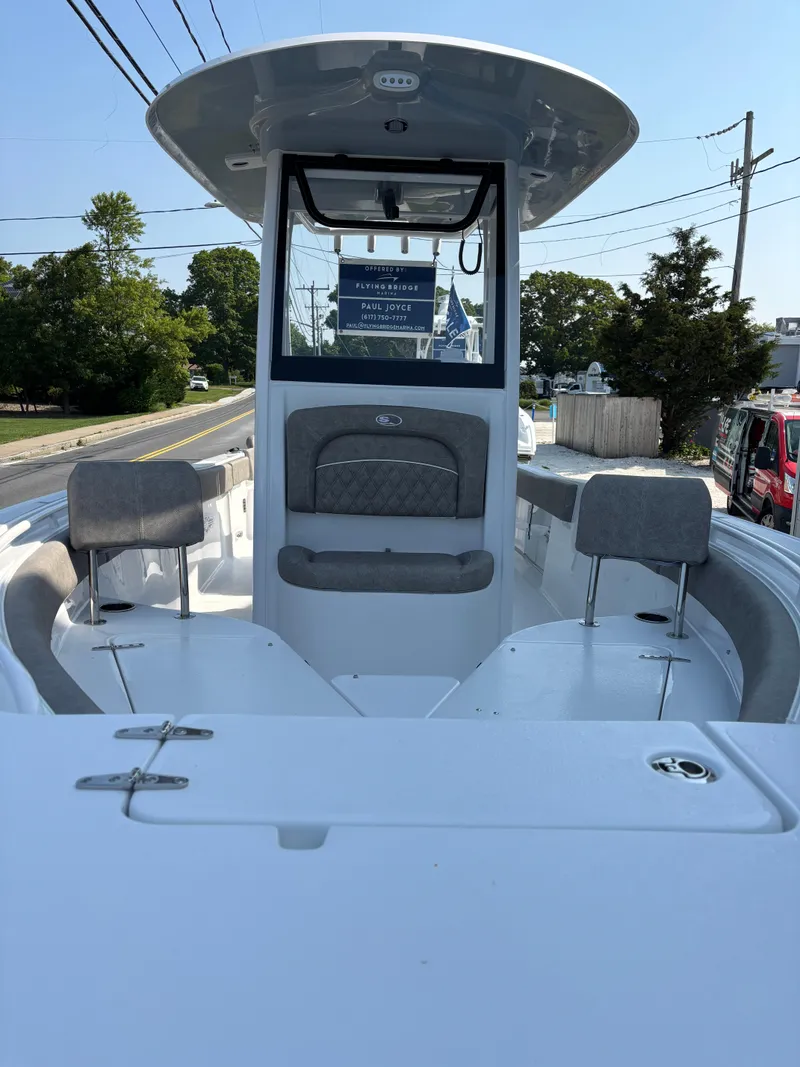 Slide: The Image of 2026 Sea Hunt Ultra 235 SE boat with spacious seating and modern design. - 6