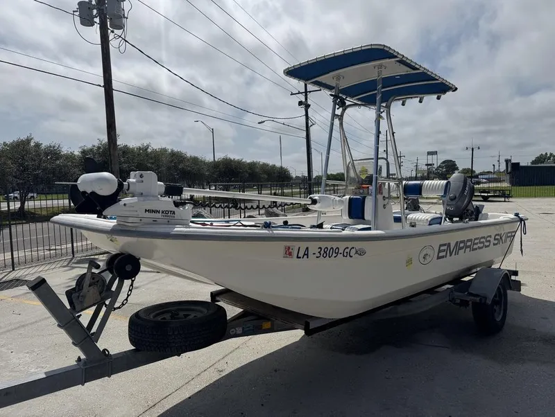 Slide: The Image of 2010 Carolina Skiff DLV 178 boat on trailer, featuring Minn Kota trolling motor. - 12