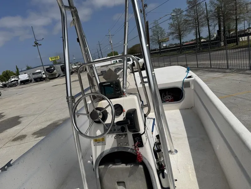 Slide: The Image of 2010 Carolina Skiff DLV 178 boat interior with steering wheel and control panel. - 15
