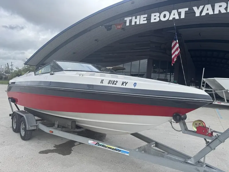 Slide: The Image of 1990 Rinker 206 Captiva Cuddy boat on trailer at The Boat Yard. - 3